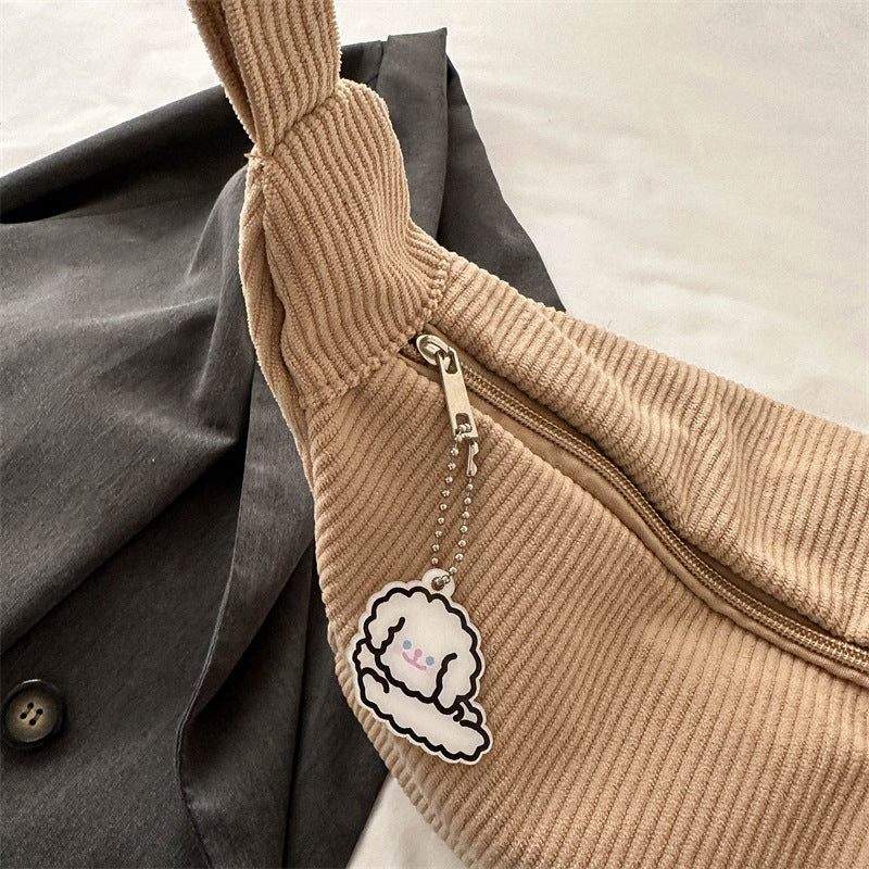 Dames corduroy schoudertas met artistiek design
