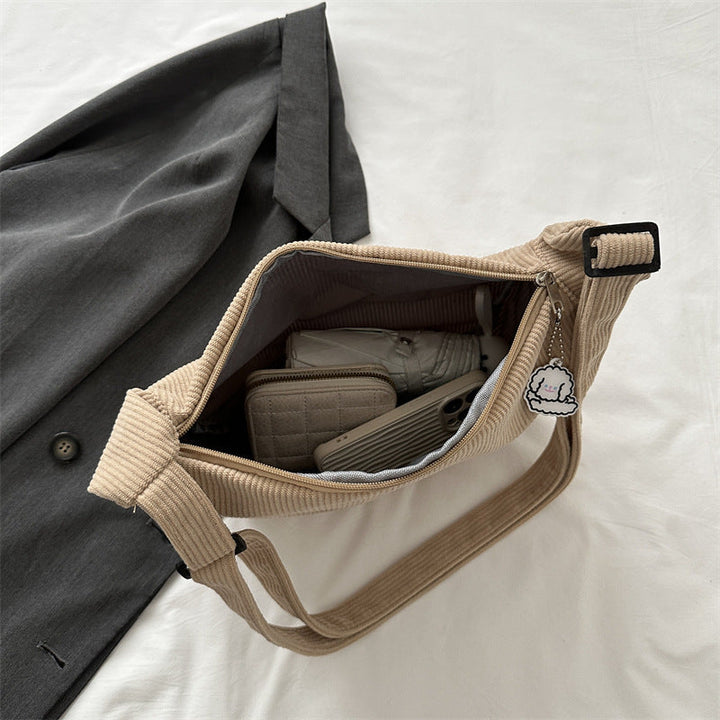 Dames corduroy schoudertas met artistiek design