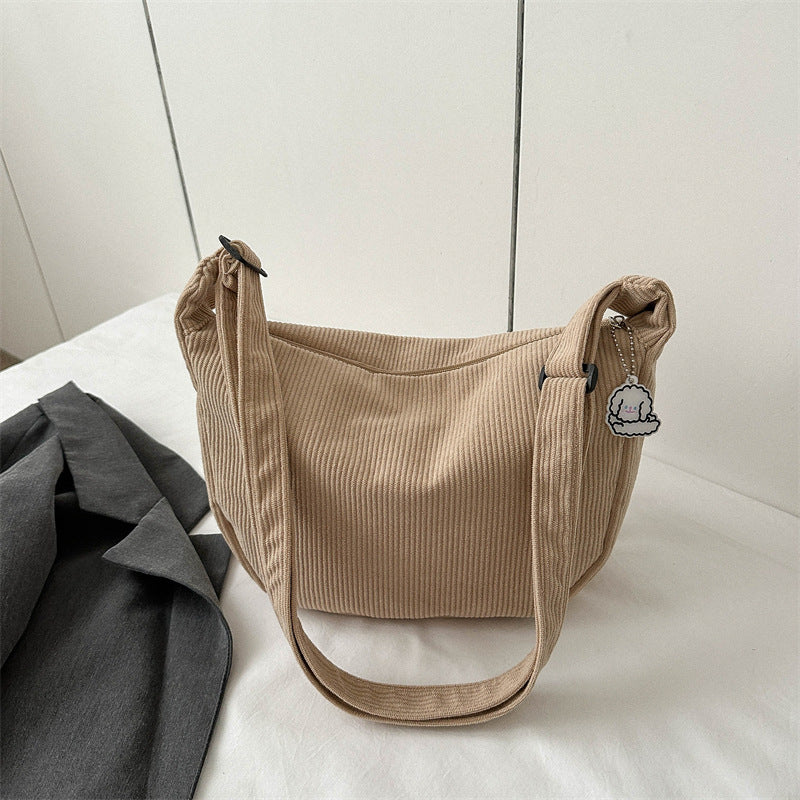 Dames corduroy schoudertas met artistiek design
